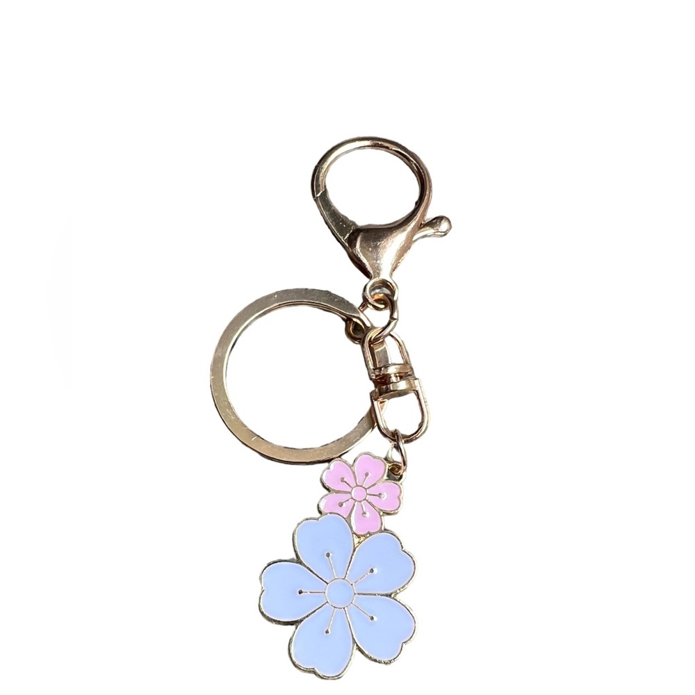 NEW without tags Flower Keychain, or bag charm. Never been used.